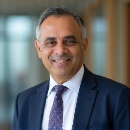 Professional portrait of Rajan Sharma, Managing Director of Surakshak Praharak Services